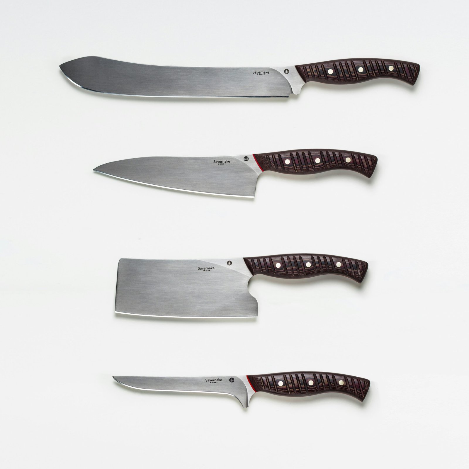 Four kitchen knives with stainless steel blades and dark textured handles displayed on a white background.